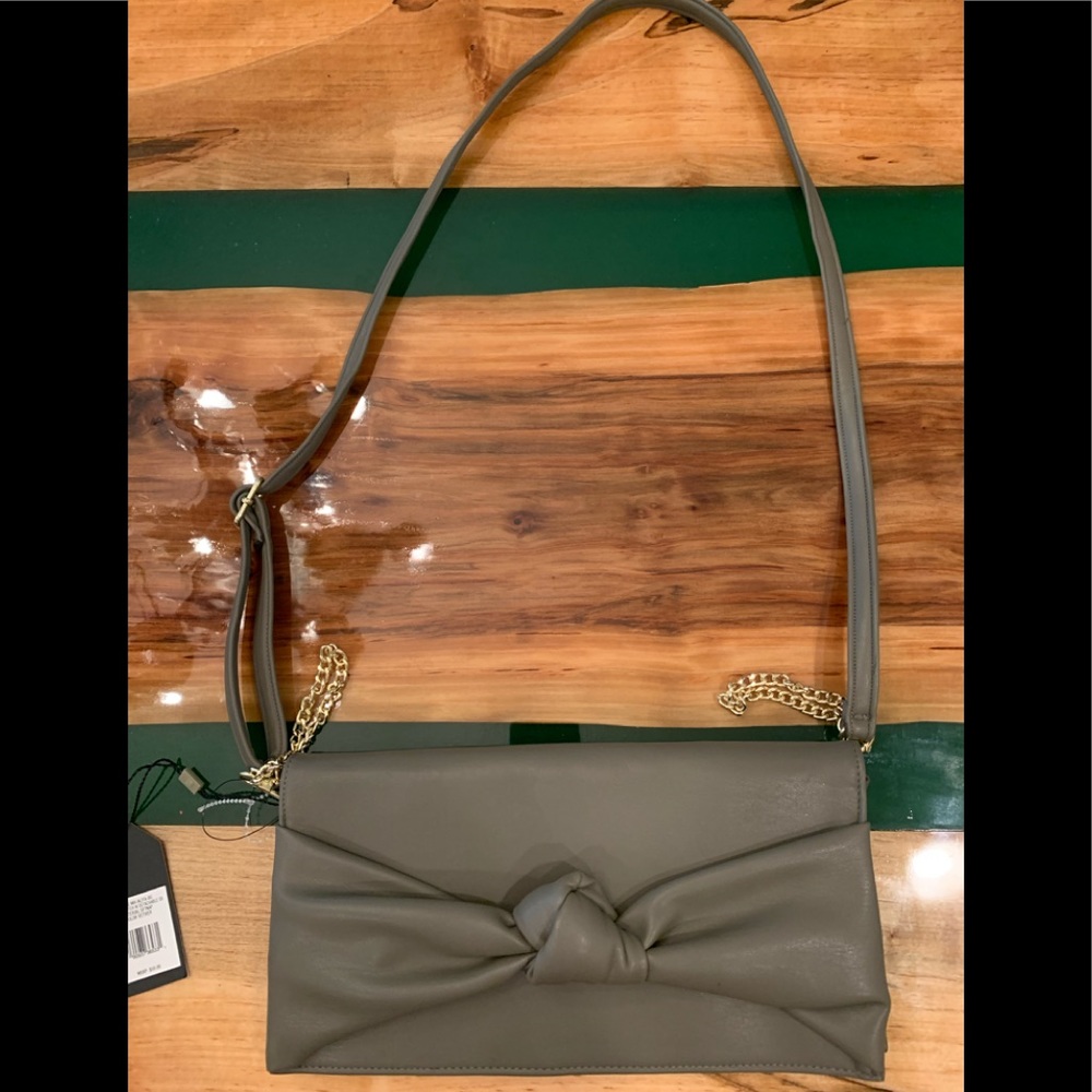 Taupe colored clutch with shoulder strap